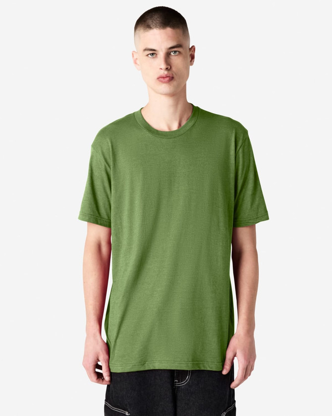A unisex short sleeve T-shirt in a vibrant green colour, displayed on a model standing against a plain background.
