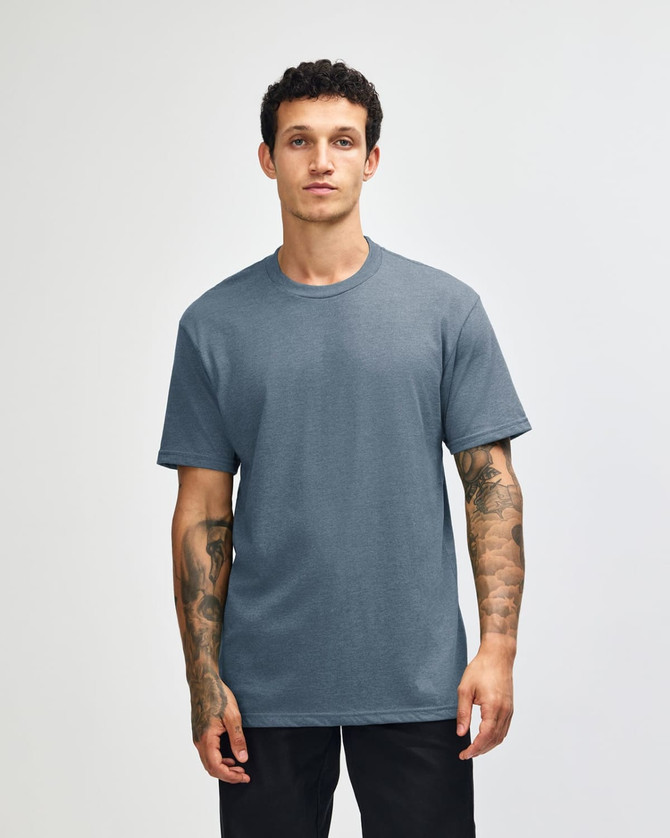 A unisex CVC short sleeve t-shirt in a blue colour, featuring a logo on the front.