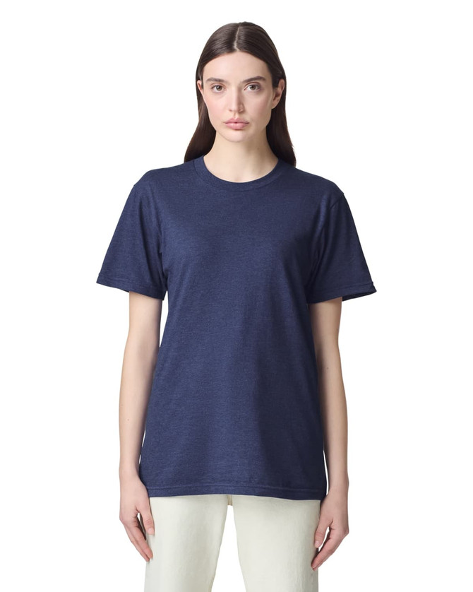 A unisex navy short sleeve t-shirt displayed on a model. The shirt features a simple design and has a branding logo.
