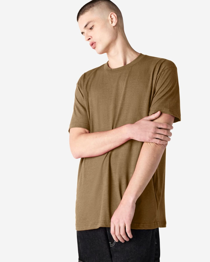 A unisex short sleeve t-shirt in a muted brown colour, displayed on a model. Features a logo.