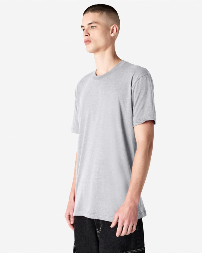 A grey unisex CVC short sleeve t-shirt displayed on a model. The shirt has a simple design and features a logo.
