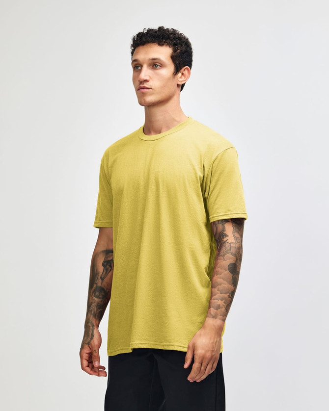 A unisex short sleeve t-shirt in a vibrant yellow colour with a casual fit, displayed on a model.