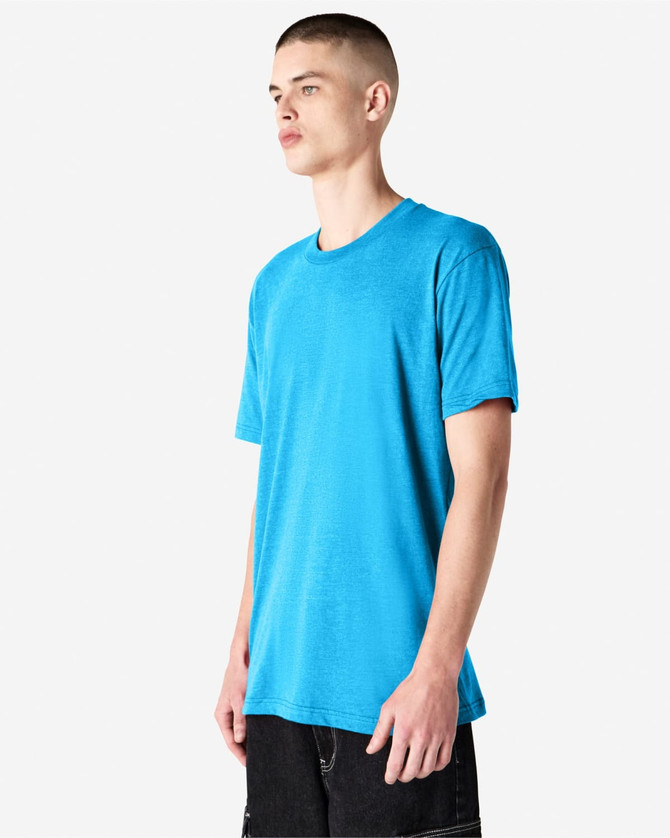 A model wearing a blue unisex short sleeve t-shirt, displaying a simple design and a relaxed fit.