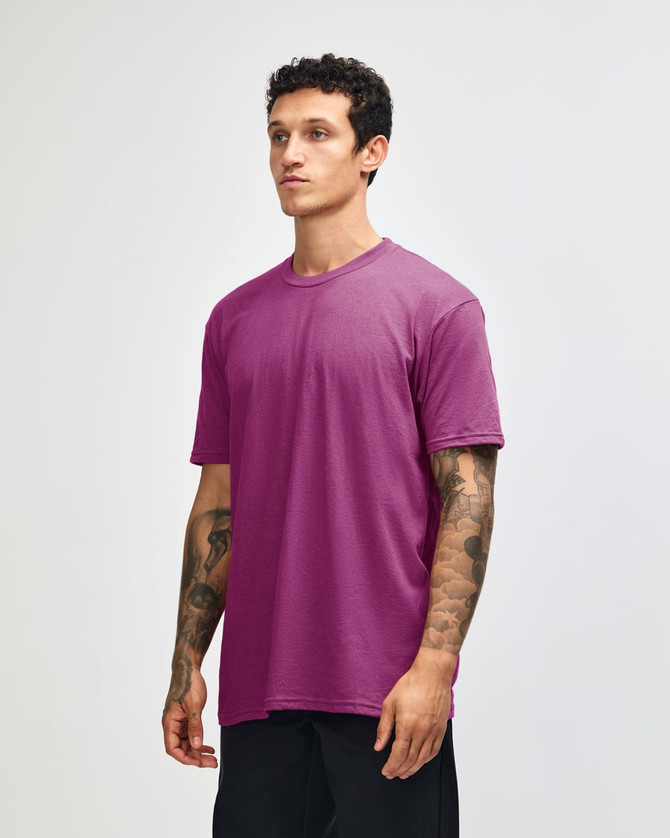 A unisex short sleeve T-shirt in vibrant pink, featuring a simple design and a small logo.