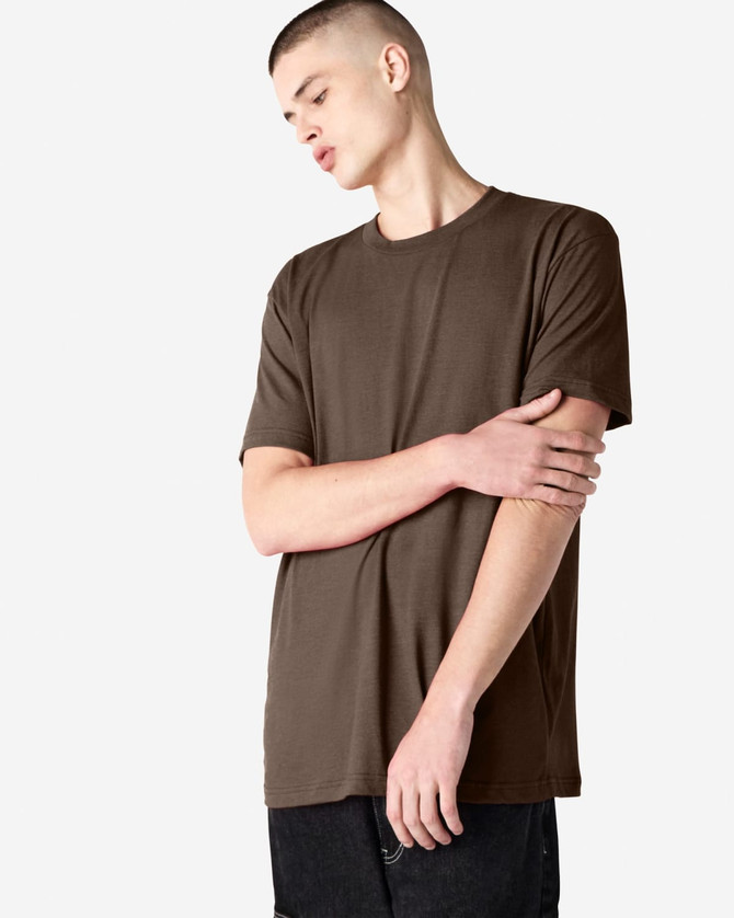 Unisex short sleeve t-shirt in brown, featuring a simple design and a logo on the fabric.