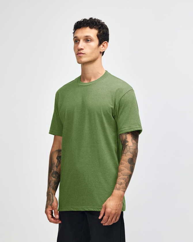 A green unisex CVC short sleeve T-shirt displayed on a model, featuring a simple design and a logo.