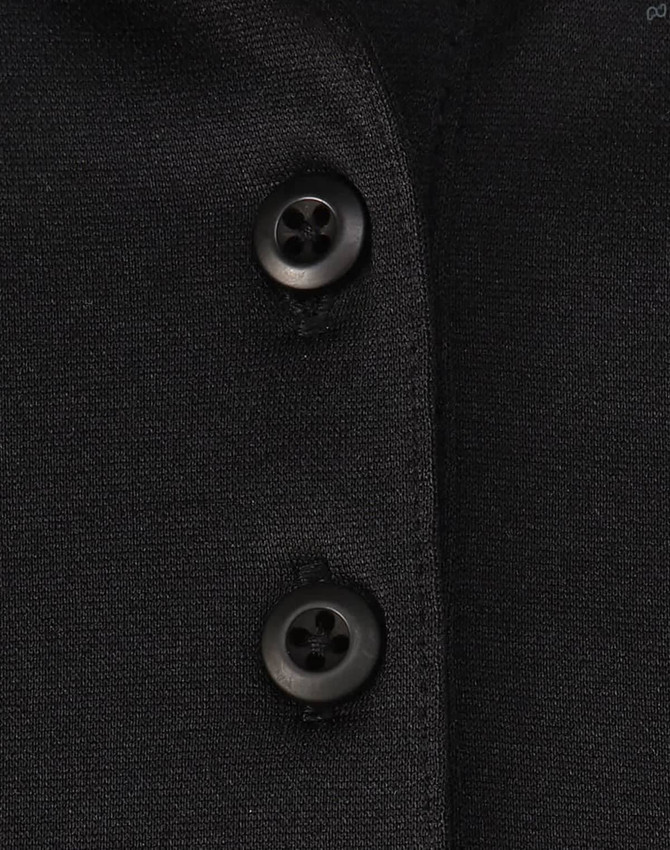 A close-up of a black polo shirt featuring buttons and a subtle texture, highlighting its sustainable fabric.