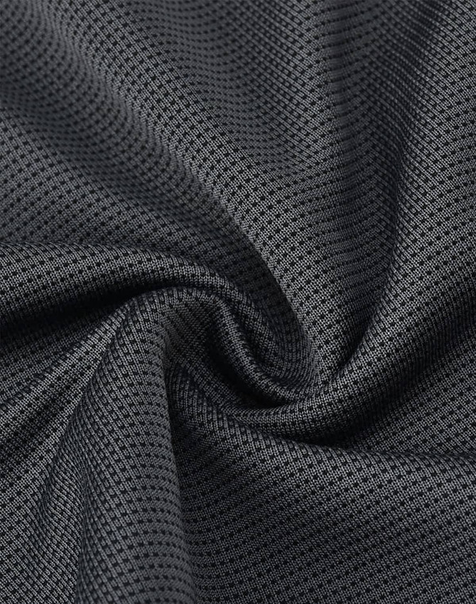 A close-up of textured black fabric, showcasing a lightweight and breathable mesh design suitable for sports apparel.