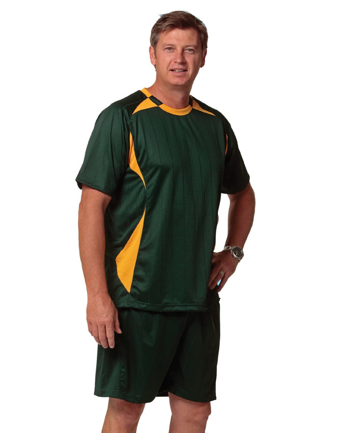 Green and yellow adults' soccer shorts paired with a matching top, featuring a logo on the chest.