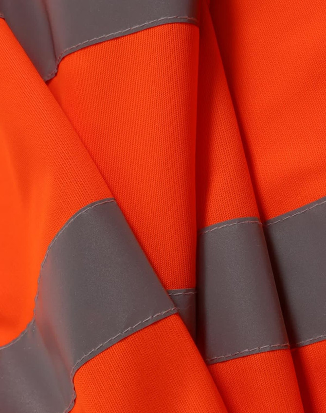 An orange safety vest with grey reflective shoulder tapes, showcasing its bright, high-visibility fabric.