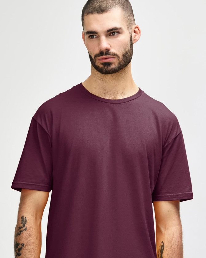 A close-up of a male model wearing a maroon Gildan Softstyle adult T-shirt with a round neckline.