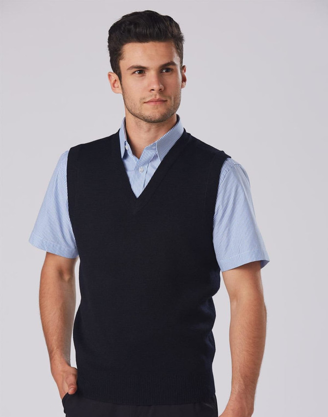 A navy V-neck wool and acrylic knit vest worn over a light blue collared shirt, featuring a logo.