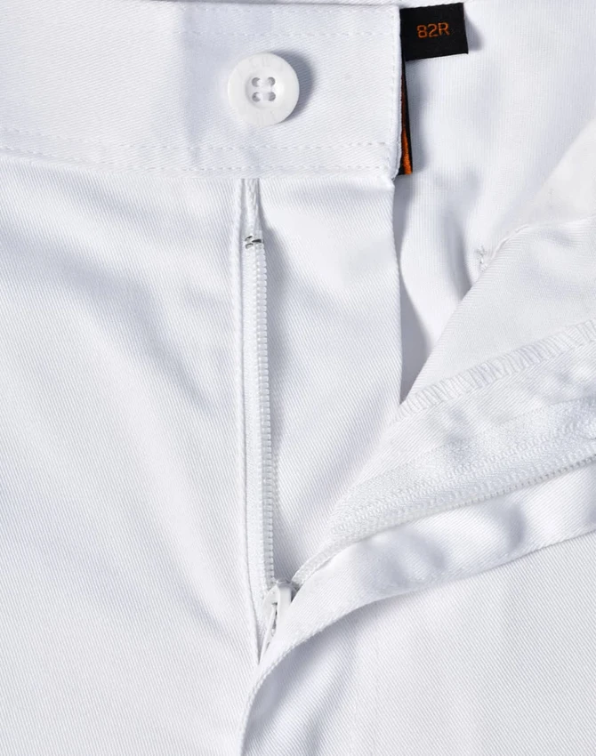 A close-up view of white unisex utility stretch cargo work pants showcasing the waistband and button detail.