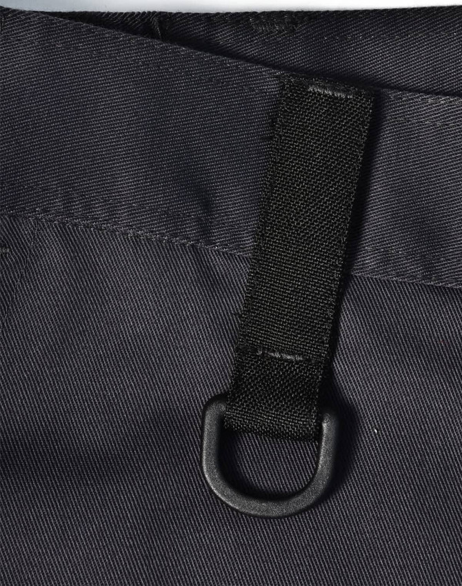 A close-up of black unisex utility stretch cargo work pants featuring a loop and sturdy fabric texture.