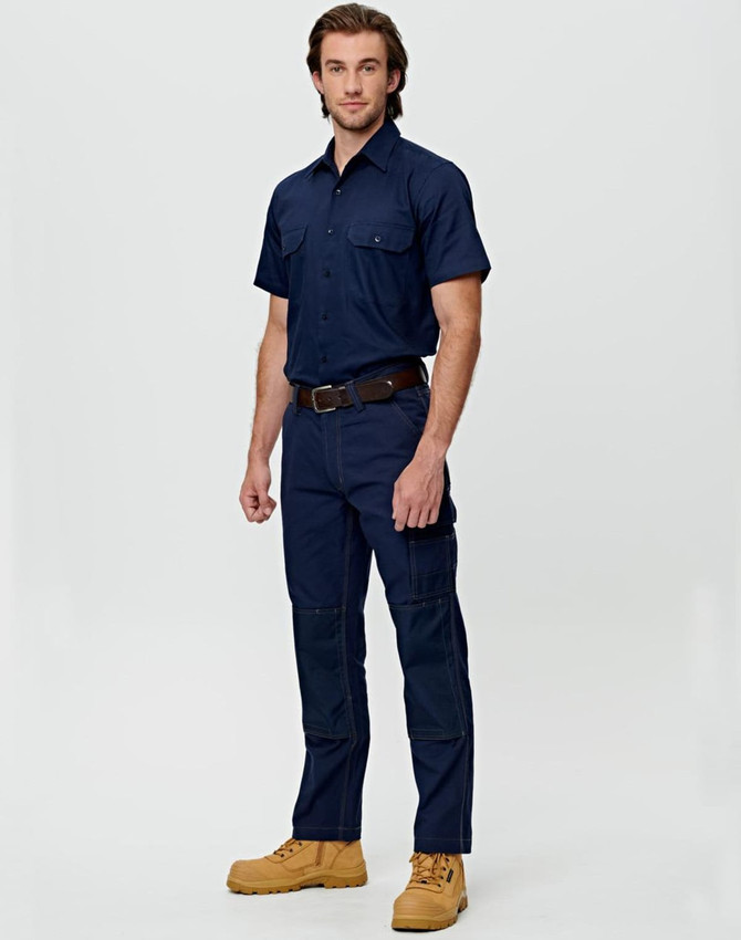 Lightweight semi-fitted work pants in navy, featuring cargo pockets, worn by two individuals in orange shirts.