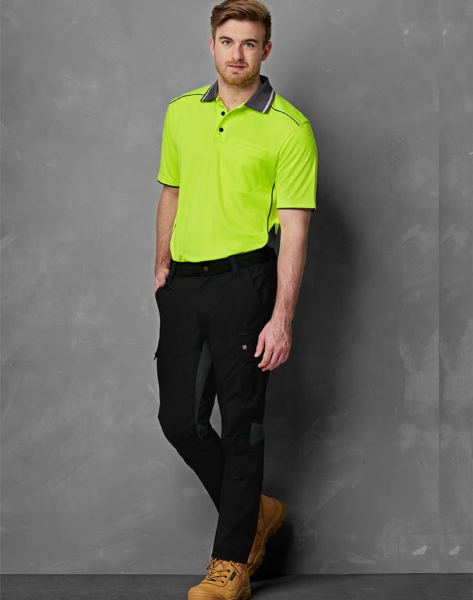 Work pants in black with rip-stop fabric, paired with a bright yellow short-sleeve polo shirt. Features a logo.