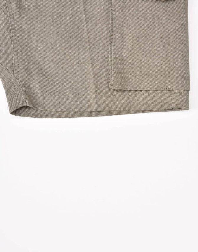 A pair of unisex cotton stretch ripstop work shorts in a light khaki colour, featuring a pocket and stitching details.