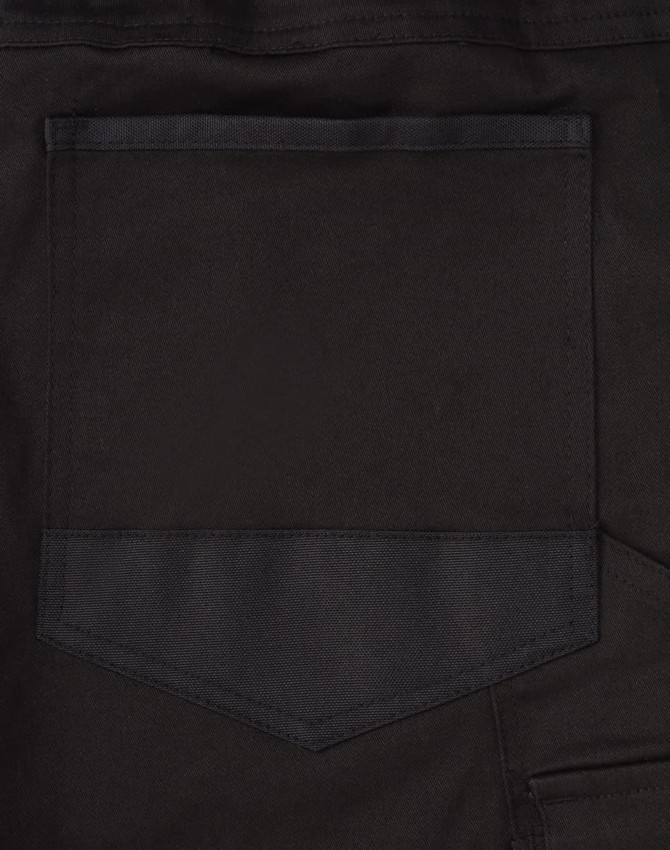 A close-up image of the back pocket of black unisex cotton stretch drill cuffed work pants.