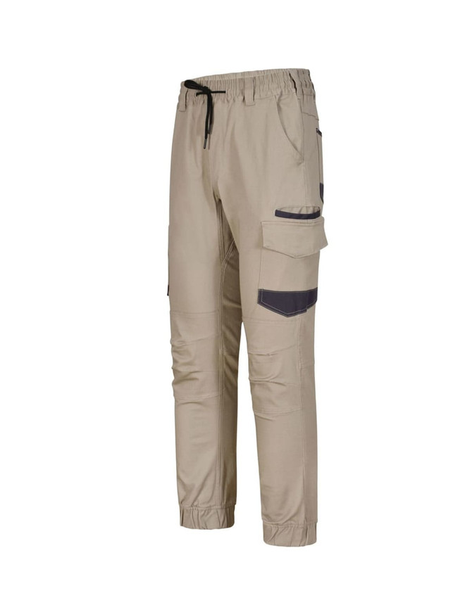 Unisex cotton stretch drill cuffed work pants in beige with pockets and a drawstring waist. Features branding details.