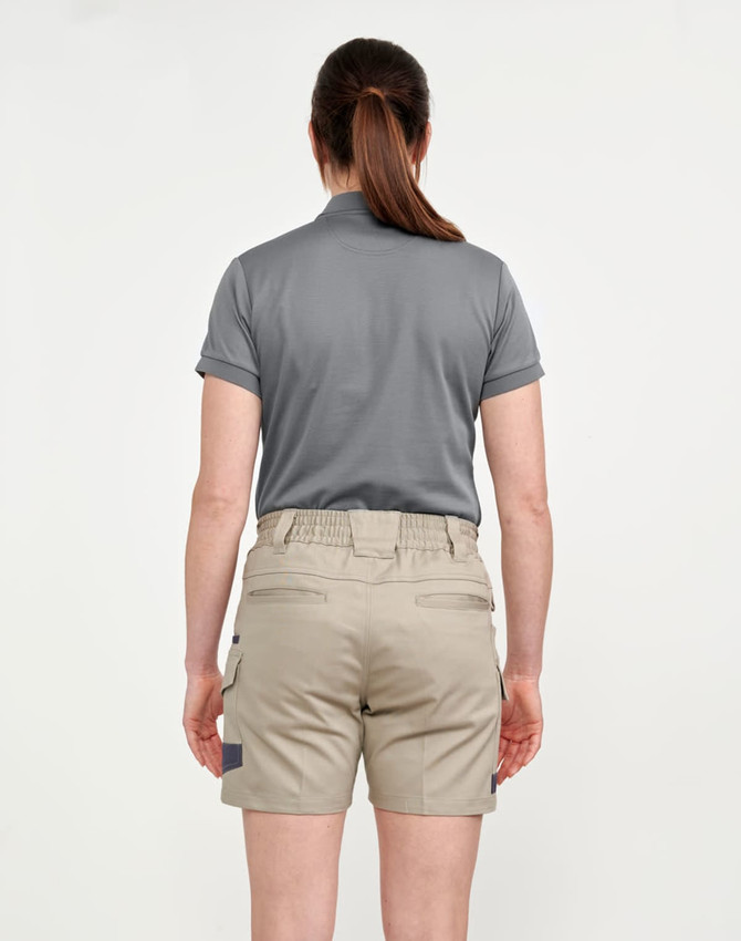 A pair of unisex cotton stretch drill work shorts in khaki, featured with a back view of a person wearing them.