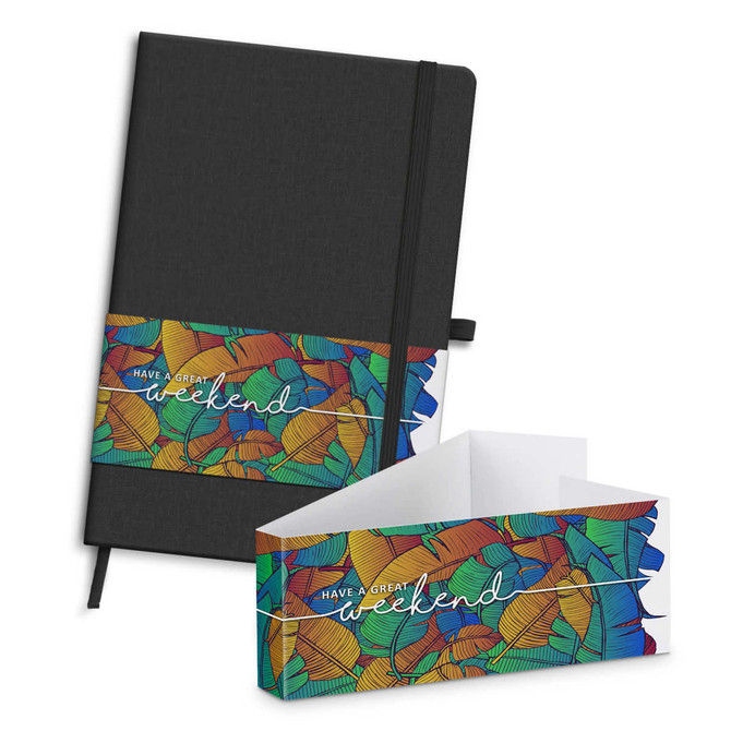 A black notebook with an elastic band, featuring a colourful leaf-patterned sleeve and a matching envelope.
