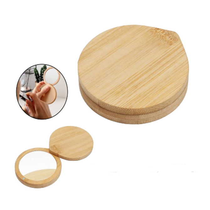 A round bamboo mirror with a smooth finish. It features a small handle and is lightweight in design.