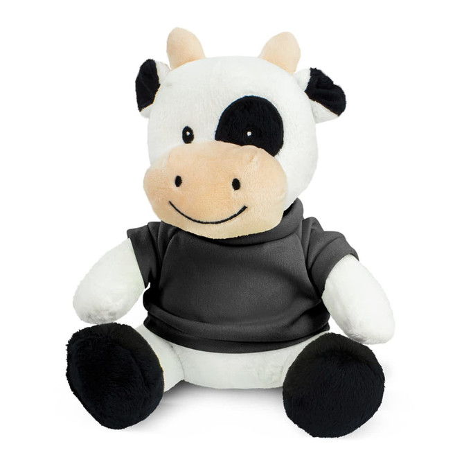 A plush cow toy with a black and white pattern, wearing a grey shirt, sitting upright with a friendly expression.