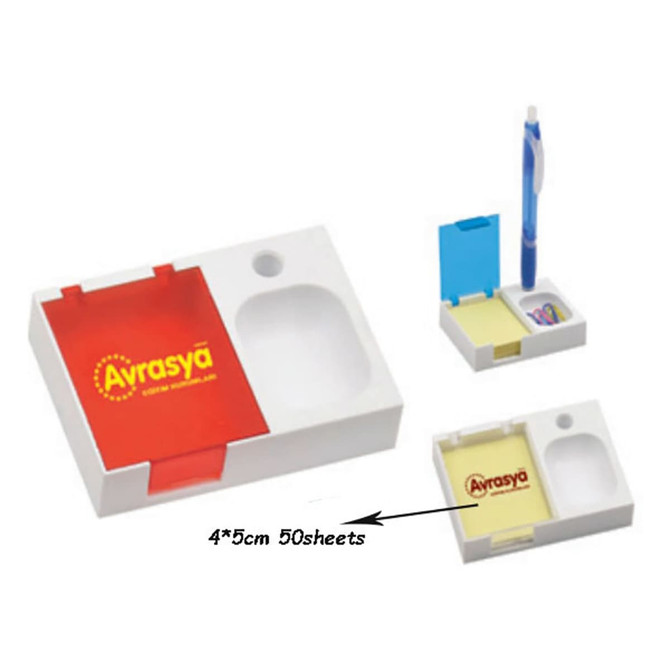 A white pen holder with a compartment for sticky notes, a pen, and a section for paperclips, featuring a logo.