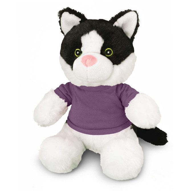 A plush cat toy with black and white fur, featuring green eyes and wearing a purple T-shirt. It has a logo on it.