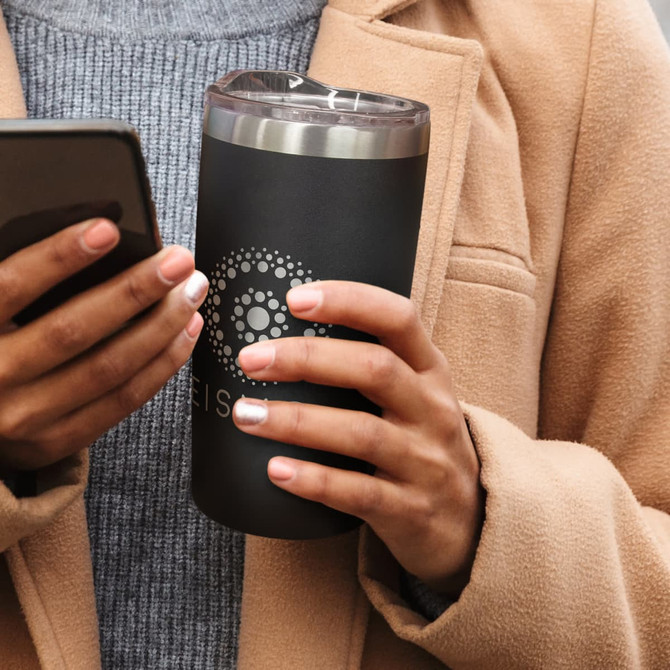A drink bottle in matte black with a stainless steel lid, held by a person wearing a beige coat.