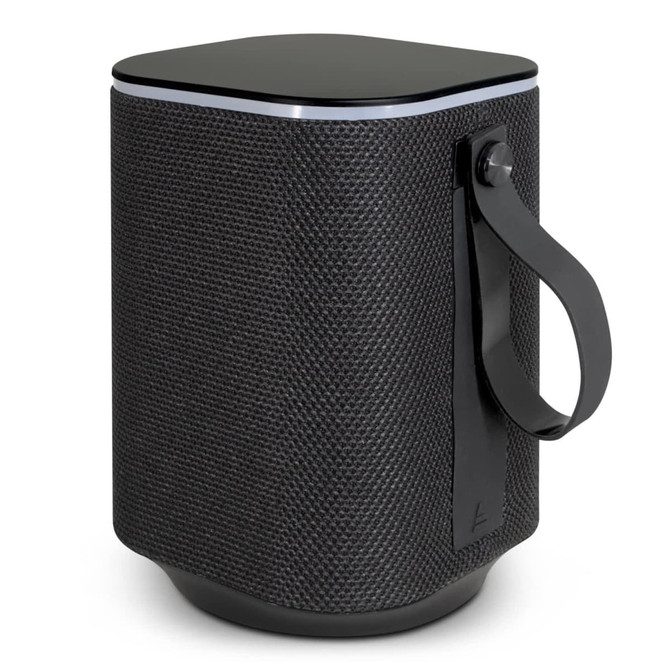 A cylindrical Bluetooth speaker in black with a textured fabric finish and a carrying strap.