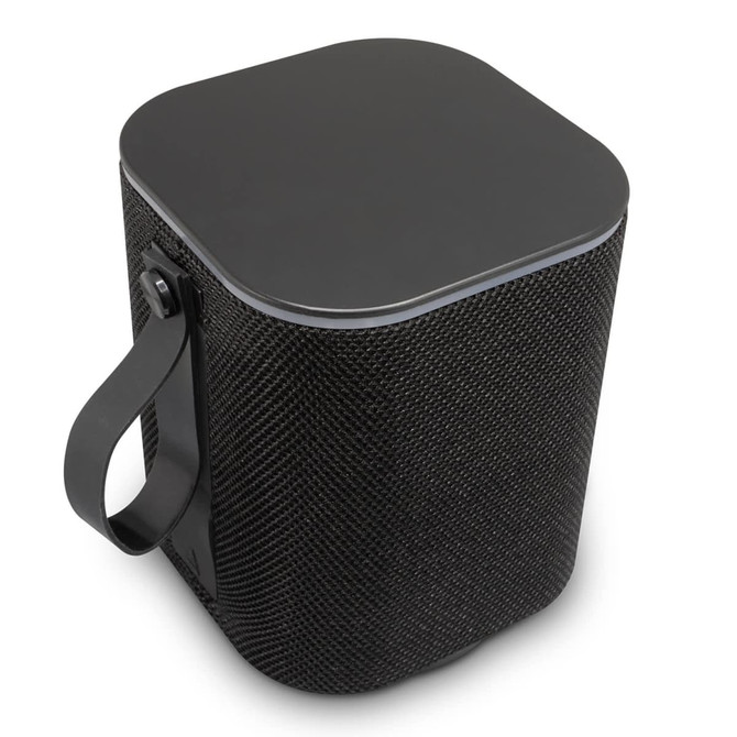 A black Bluetooth speaker with a textured exterior and a handle for easy carrying. It features a square top design.