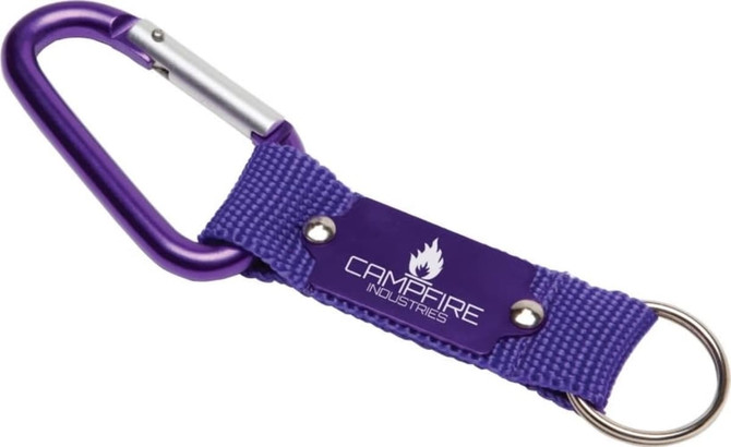 A purple keyring with a carabiner and a fabric strap featuring a logo. Ideal for attaching keys or tools.