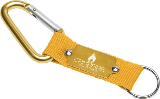 A yellow keyring with a carabiner and a fabric strap, featuring a branded metal plate.