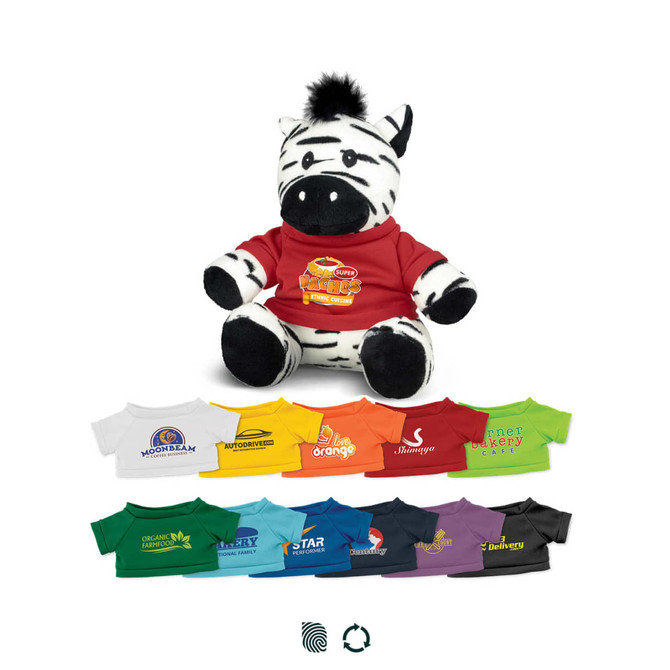 A plush zebra toy wearing a red shirt, surrounded by various coloured shirts in different hues. The toy features a logo.