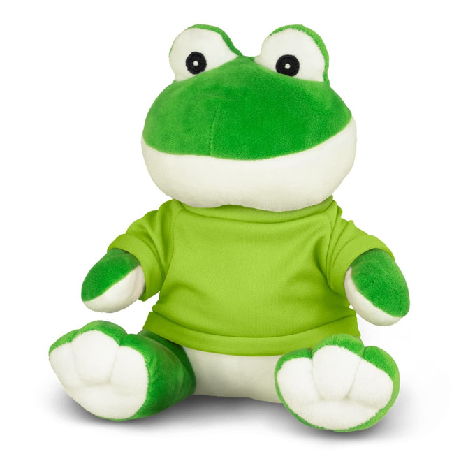 A green frog plush toy wearing a bright green shirt, sitting with its legs stretched out. It has a friendly expression and a logo.