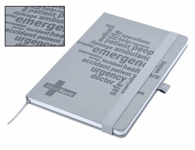 A grey A5 notebook with debossed text and a ribbon bookmark, featuring a logo on the cover.
