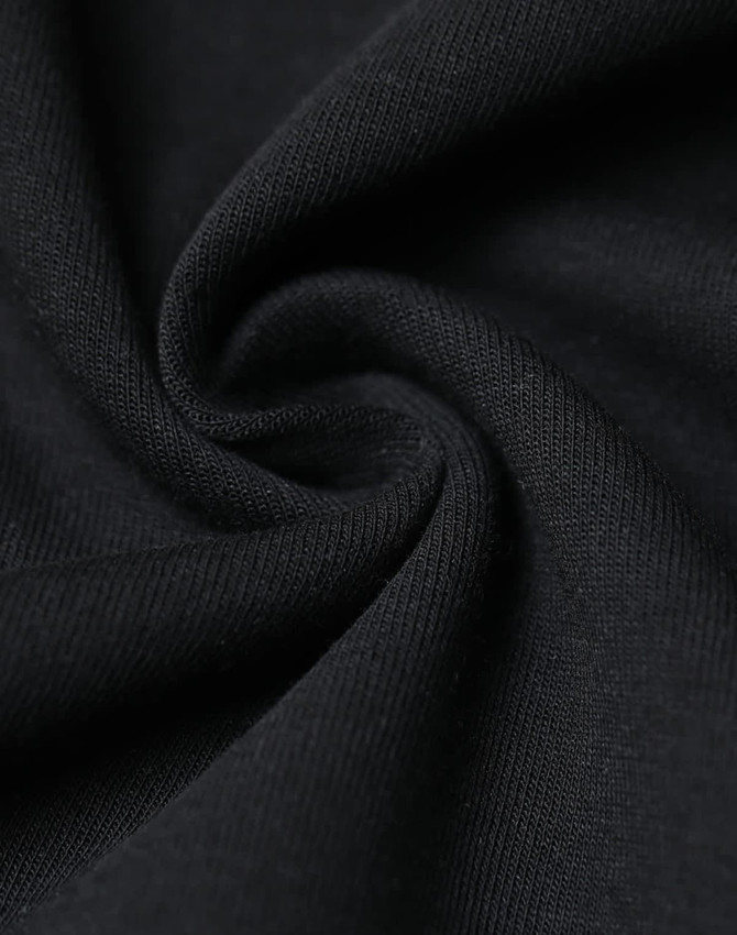 A close-up of fabric in a black, soft, and stretchy material, showcasing a smooth texture.