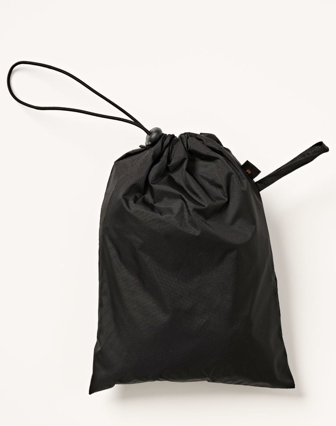 A black drawstring bag made of lightweight nylon, designed for waterproof storage. It features a logo on the side.
