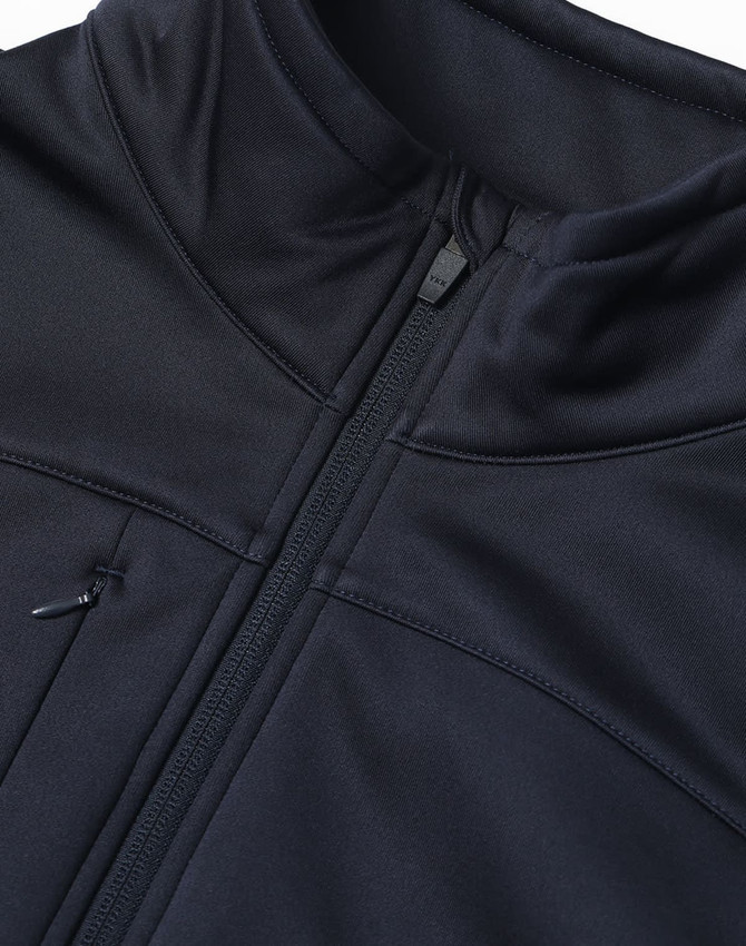 A black sustainable softshell jacket featuring a zip closure and a high collar, with an attached logo.