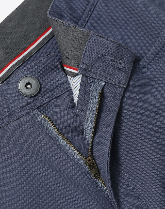 Navy blue Men's Jean Style Flexi Chino Pants featuring a button and zip fly. Includes a branded logo.