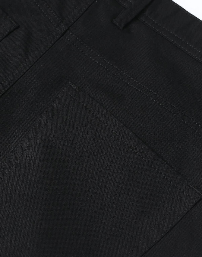 Black flexi chino pants featuring a back pocket and detailed stitching. Includes a logo.