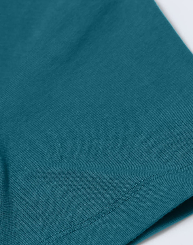 A close-up of a teal men's premium cotton short sleeve tee shirt, showcasing the fabric texture and stitching.