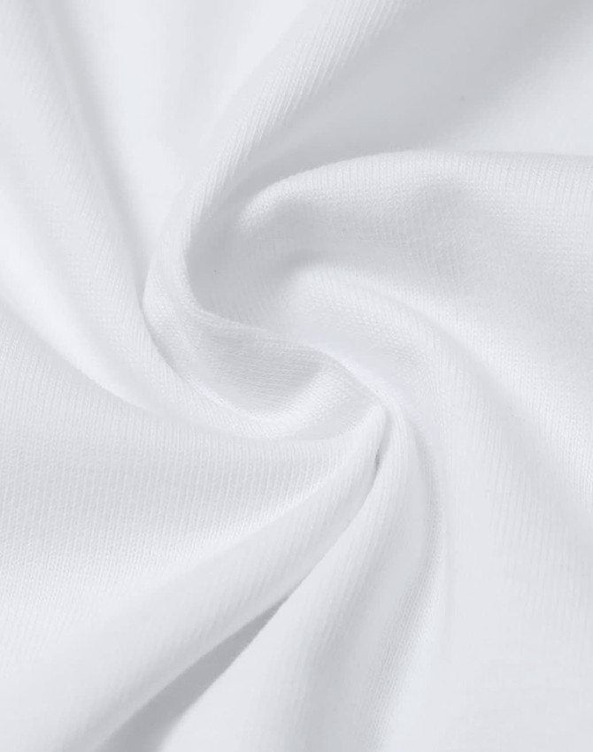 A close-up of white cotton fabric, showcasing a soft texture with a smooth, twisted design.
