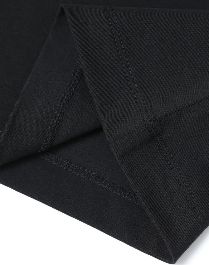 A close-up of a black premium cotton T-shirt, showcasing the fabric texture and stitching detail.
