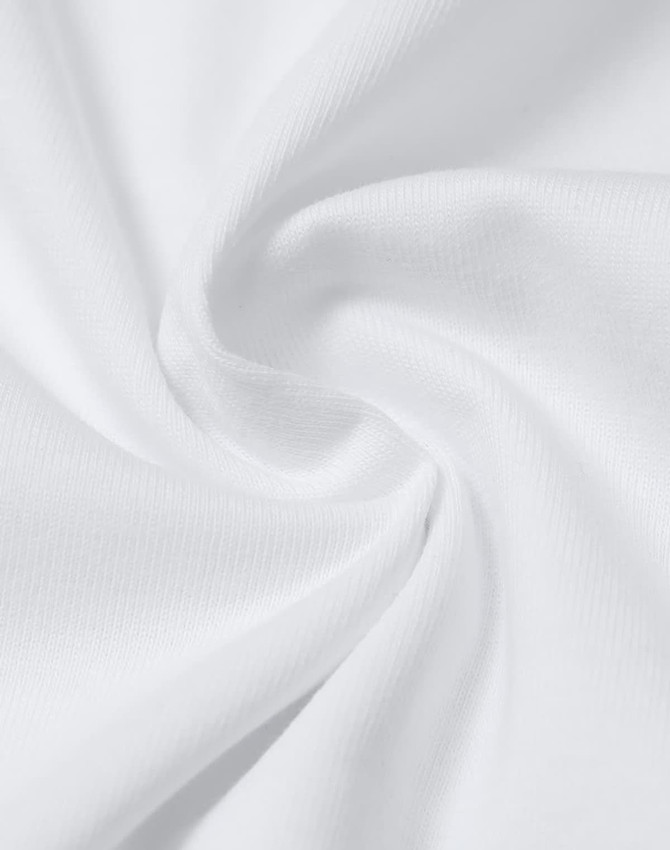 A close-up of white cotton fabric, showcasing its soft texture and smooth weave, with a slight twist.