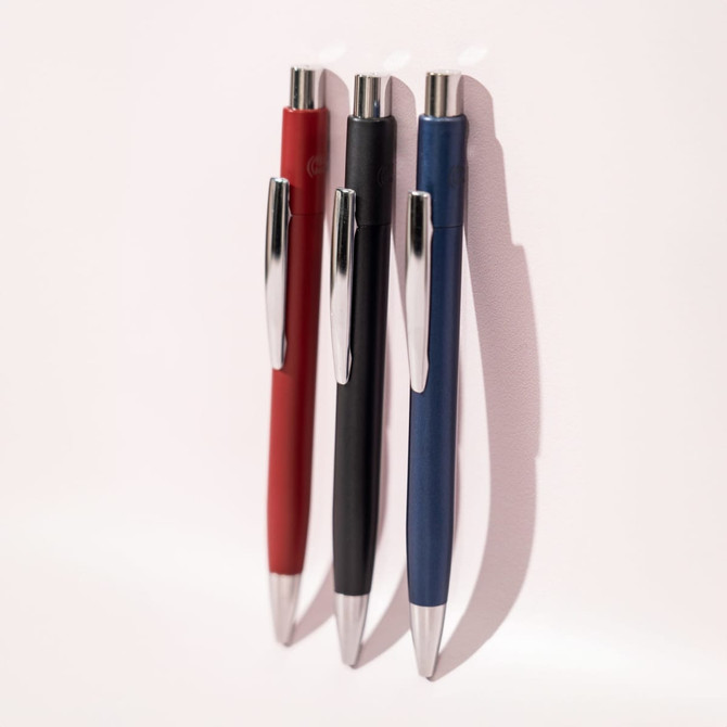 Three ballpoint pens in red, black, and blue, featuring shiny silver accents and a sleek design.