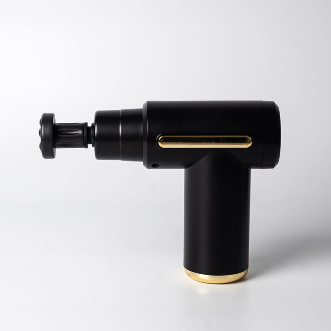 A black massage gun with gold accents, featuring an adjustable head and a sleek design. It has a logo on the side.