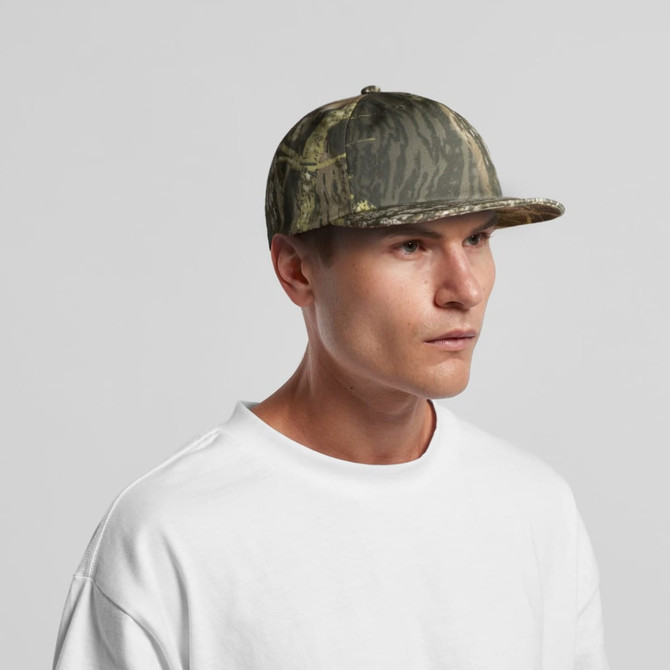 A camo cap in various shades of green, featuring a curved brim and a logo on the front.