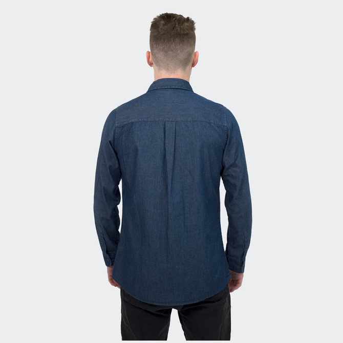 A denim shirt in a dark blue shade, featuring a button-up design and long sleeves, with a branded logo.